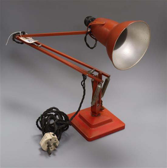 A 1960s orange anglepoise lamp